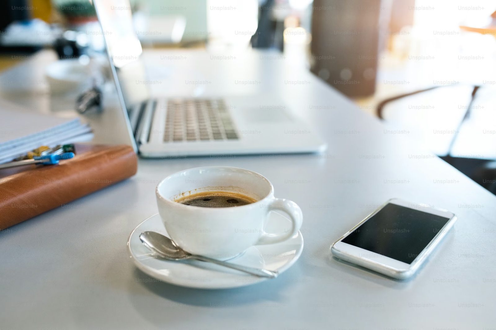 A writing desk with laptop and morning coffee in a City Room