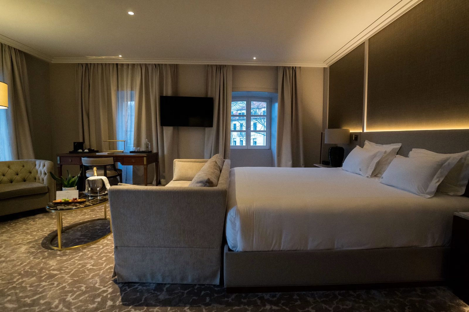 City Room with a king bed, crisp white linen and warm reading light
